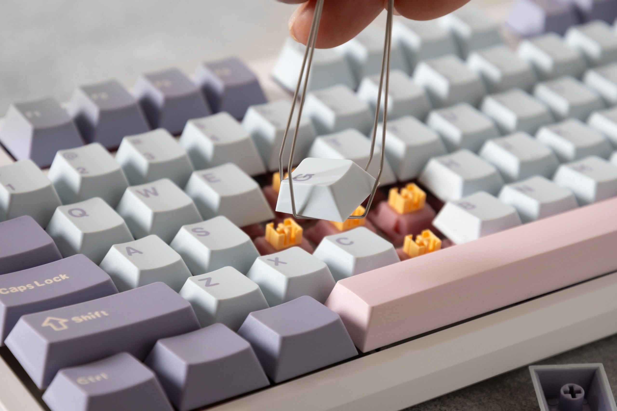Custom mechanical keyboard with keycaps and switches removed during customization