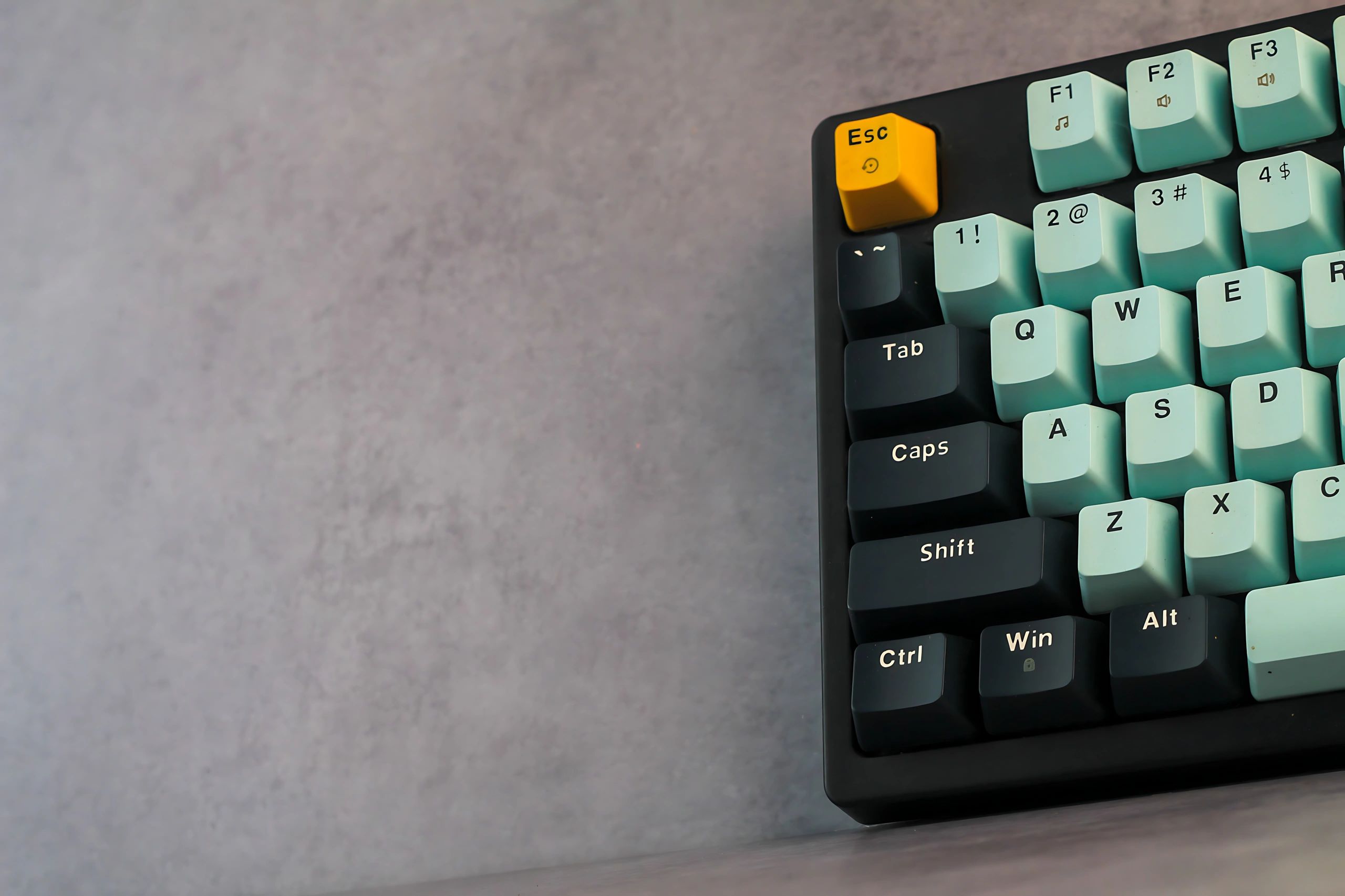 Custom mechanical keyboard with mint green and black keycaps